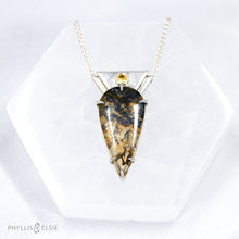 Load image into Gallery viewer, Reminiscent of Art Deco designs, this stunning Dendritic Quartz is held in a 6-prong claw setting crowned with a glowing spark of Golden Topaz.   Details:  Solid sterling silver, partially recycled  Dendritic Quartz with Golden Topaz  Pendant 19mm x 36mm  16” long Sterling Silver wheat chain plus 2” Extender  Lobster claw clasp