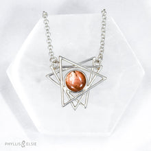 Load image into Gallery viewer, A big shimmering Sunstone cabochon sits nestled in the center of an openwork array of silver points. This necklace pairs beautifully with the Kasey earrings.   Details  Solid sterling silver, partially recycled  Sunstone  Pendant: 30mm x 28mm  17" long plus 2" extender  lobster claw clasp