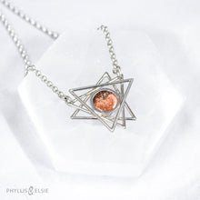 Load image into Gallery viewer, A big shimmering Sunstone cabochon sits nestled in the center of an openwork array of silver points. This necklace pairs beautifully with the Kasey earrings.   Details  Solid sterling silver, partially recycled  Sunstone  Pendant: 30mm x 28mm  17" long plus 2" extender  lobster claw clasp