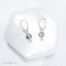Load image into Gallery viewer, Sweet dewdrops of Ethiopian Opals glow with shades of blue, green, and peach. White Sapphires at an extra touch of sparkle and elegant lever-back ear hooks keep your earrings secure with extra style.  Details  Solid sterling silver, partially recycled  Ethiopian Opal, White Sapphire  Earring face: 8mm x 15mm  Sterling lever-back hooks