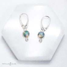 Load image into Gallery viewer, Sweet dewdrops of Ethiopian Opals glow with shades of blue, green, and peach. White Sapphires at an extra touch of sparkle and elegant lever-back ear hooks keep your earrings secure with extra style.  Details  Solid sterling silver, partially recycled  Ethiopian Opal, White Sapphire  Earring face: 8mm x 15mm  Sterling lever-back hooks