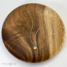 Load image into Gallery viewer, This 8mm Luna necklace features a beautiful Ethiopian Opal set simply in a smooth silver bezel. A a diamond cut chain adds a subtle sparkle to complete the clean, classic look you will find yourself wearing over and over.  Details:  Solid sterling silver, partially recycled  Ethiopian Opal  Pendant: 8mm  16” long Sterling Silver chain   Lobster-claw clasp