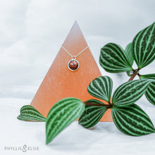 Load image into Gallery viewer, This 10mm Luna necklace features a beautiful rust colored Sunstone set simply in a smooth silver bezel. A slim oval chain completes the clean, classic look you will find yourself wearing over and over.  Details:  Solid sterling silver, partially recycled  Sunstone  Pendant: 10mm  16” long Sterling Silver chain   Lobster-claw clasp