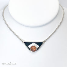 Load image into Gallery viewer, A glowing Sunstone set in a striking patinated shadowbox with a geometric window. The crisp lines of this bold pendant are balanced with a heavy silver rolo chain. Details:  Solid sterling silver, partially recycled  Sunstone  Pendant: 35mm x 17mm  18" sterling chain plus 2" extender