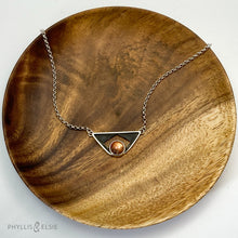 Load image into Gallery viewer, A glowing Sunstone set in a striking patinated shadowbox with a geometric window. The crisp lines of this bold pendant are balanced with a heavy silver rolo chain. Details:  Solid sterling silver, partially recycled  Sunstone  Pendant: 35mm x 17mm  18" sterling chain plus 2" extender