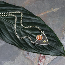 Load image into Gallery viewer, A shimmering Sunstone rises through the thick silver frame of its shadowbox. A faceted golden Topaz adds even more color and sparkle to this striking pendant.  Details:  Solid sterling silver, partially recycled  Dendritic Quartz  Pendant: 28mm x 23mm  18” long Sterling Silver chain plus 2" extension  Lobster-claw clasp
