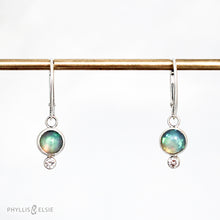 Load image into Gallery viewer, Sweet dewdrops of Ethiopian Opals glow with shades of blue, green, and peach. White Sapphires at an extra touch of sparkle and elegant lever-back ear hooks keep your earrings secure with extra style.  Details  Solid sterling silver, partially recycled  Ethiopian Opal, White Sapphire  Earring face: 8mm x 15mm  Sterling lever-back hooks