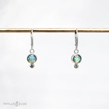 Load image into Gallery viewer, Sweet dewdrops of Ethiopian Opals glow with shades of blue, green, and peach. White Sapphires at an extra touch of sparkle and elegant lever-back ear hooks keep your earrings secure with extra style.  Details  Solid sterling silver, partially recycled  Ethiopian Opal, White Sapphire  Earring face: 8mm x 15mm  Sterling lever-back hooks