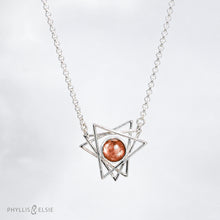 Load image into Gallery viewer, A big shimmering Sunstone cabochon sits nestled in the center of an openwork array of silver points. This necklace pairs beautifully with the Kasey earrings.   Details  Solid sterling silver, partially recycled  Sunstone  Pendant: 30mm x 28mm  17" long plus 2" extender  lobster claw clasp