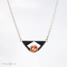 Load image into Gallery viewer, A glowing Sunstone set in a striking patinated shadowbox with a geometric window. The crisp lines of this bold pendant are balanced with a heavy silver rolo chain.  Details:  Solid sterling silver, partially recycled  Sunstone  Pendant: 35mm x 17mm  18" sterling chain plus 2" extender