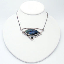 Load image into Gallery viewer, This striking necklace features a stunning deep blue and aqua labradorite marquise cabochon framed by layered silver wings and a demure jade gem. The 16” chain lets the pendant land just below the collarbone. The .925 Sterling silver surround has an oxidized and antiqued finish, giving this piece the look of an heirloom treasure with a story to tell.