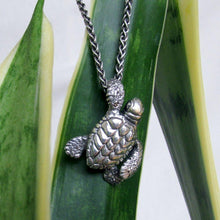 Load image into Gallery viewer, Handmade .925 Sterling silver Loggerhead Sea Turtle pendant on .925 Sterling wheat chain with a lobster clasp  We donate a portion of all WildWhere sales to support continuing wildlife conservation efforts!