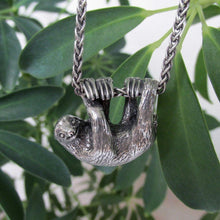 Load image into Gallery viewer, Our charming Three-Toed Sloth hangs happily from a lovely wheat chain, happy to watch the world from a safe perch around your neck! With life-like detail and cuteness to spare, your new silver pal is sure to draw lots of compliments!  We donate a portion of all WildWhere sales to support continuing wildlife conservation efforts!