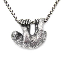 Load image into Gallery viewer, Our charming Three-Toed Sloth hangs happily from a lovely wheat chain, happy to watch the world from a safe perch around your neck! With life-like detail and cuteness to spare, your new silver pal is sure to draw lots of compliments!  We donate a portion of all WildWhere sales to support continuing wildlife conservation efforts!
