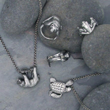 Load image into Gallery viewer, Handmade .925 Sterling silver Loggerhead Sea Turtle pendant on .925 Sterling wheat chain with a lobster clasp  We donate a portion of all WildWhere sales to support continuing wildlife conservation efforts! Also shown, grizzly bear, sea otter, sloth, and tree frog jewelry