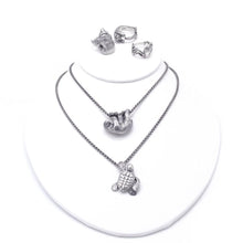 Load image into Gallery viewer, Handmade .925 Sterling silver Loggerhead Sea Turtle pendant on .925 Sterling wheat chain with a lobster clasp  We donate a portion of all WildWhere sales to support continuing wildlife conservation efforts! Also shown, grizzly bear, sea otter, sloth, and tree frog jewelry