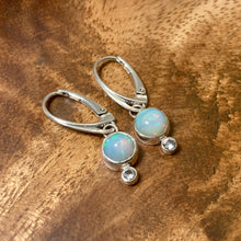 Load image into Gallery viewer, Sweet dewdrops of Ethiopian Opals glow with shades of blue, green, and peach. White Sapphires at an extra touch of sparkle and elegant lever-back ear hooks keep your earrings secure with extra style.  Solid sterling silver, partially recycled  Ethiopian Opal, White Sapphire  Earring face: 8mm x 15mm  Sterling lever-back ear hooks