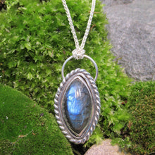 Load image into Gallery viewer, Our Daphne necklaces all feature a stunning deep blue marquise cut Labradorites. This royal hue is one of the most desired shades of the stone and looks stunning set in silver.  This Daphne is wrapped by a silver twist and crowned with a large circular bail through which a shimmery silver chain is looped

