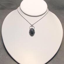 Load image into Gallery viewer, Daphne necklace on a white bust display. Our Daphne necklaces all feature a stunning deep blue marquise cut Labradorites. This royal hue is one of the most desired shades of the stone and looks stunning set in silver.  This Daphne is surrounded by a hammered silver halo and crowned with a large circular bail through which a shimmery silver chain is looped.
