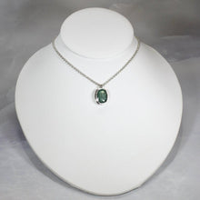 Load image into Gallery viewer, A beautiful hand-cut emerald is showcased in a simple banded bezel - geometric but still natural. A thicker rolo chain balances out the small but solid pendant and a two-inch extender gives you flexibility with different necklines. 
