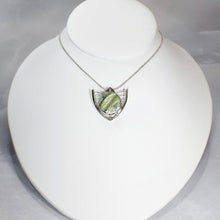 Load image into Gallery viewer, Faye features delicate handcrafted wings to frame this necklace’s substantial eye-catching Green Opal. A beautiful spring green, the stone is striped with shimmering bands and accented by a tiny drop of yellow-green labradorite.
