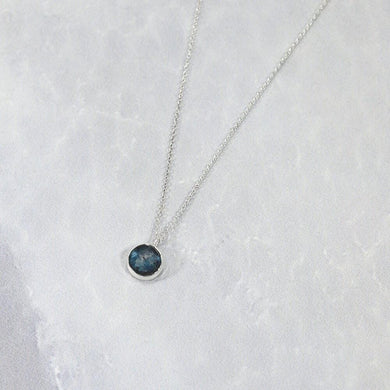 These sweet little pendant features an ethically sourced rosecut Teal Kyanite set in a simple recycled silver bezel. At 9mm wide, it is the perfect size for everyday wear while still adding a flash of sparkle  to your look! This necklace pairs perfectly with the Luna Teal Kyanite Studs