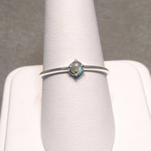 Load image into Gallery viewer, An even daintier version of our Laura band, a 3mm Labradorite gleams in  4 prongs centered on a super slim knife-edge band that measures just over 1mm wide. A comfortable, easy-wearing band with a touch of shimmer, perfect for stacking with other rings or alone for a classic look.
