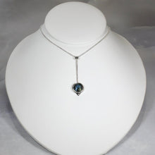 Load image into Gallery viewer, With its exceptional deep blue Labradorite, Taylor carries a mystical hint of midnight. Dangling from a wheat chain and accented by a thin silver band and tiny silver pebble, this necklace is delicate but eye-catching.
