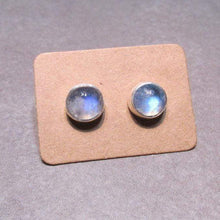 Load image into Gallery viewer, These sweet little studs feature ethically sourced rainbow moonstones set in a simple recycled silver bezel. At 9mm wide, they are the perfect size for everyday wear while still adding a flash of shimmer to your look! Solid sterling studs and surgical steel butterfly backings provide a secure fit for sensitive skin. These moondrops come in a range of colours from pearly white to twilight blue so you can pick your perfect pair!
