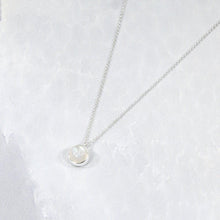 Load image into Gallery viewer, This 9mm Luna necklace features a beautiful round Rainbow Moonstone simply set in a smooth silver bezel. A simple oval chain completes the clean, classic look you will find yourself wearing over and over.
