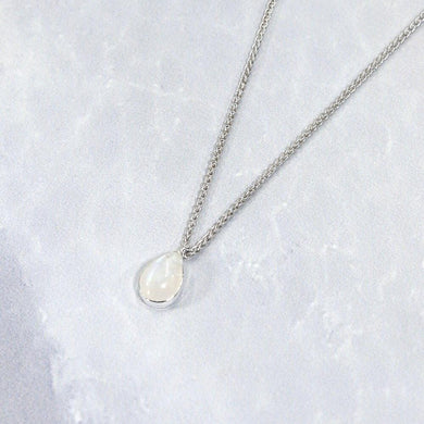 Simple and sweet, the Tess moonstone necklace is a jewel you will reach for over and over. A beautiful blue flash in the cloud-white stone set in a classic silver bezel adds the perfect touch of glam to this easy to wear necklace.