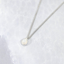 Load image into Gallery viewer, Simple and sweet, the Tess moonstone necklace is a jewel you will reach for over and over. A beautiful blue flash in the cloud-white stone set in a classic silver bezel adds the perfect touch of glam to this easy to wear necklace.
