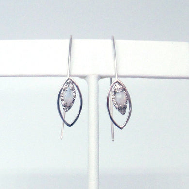 These delicate dangles feature fire opals with soft flashes of pink, orange, and green, set on hand textured .925 Sterling Silver. Long silver ear wires are hardened for stability and hang behind for added dimension and balance.