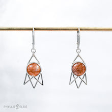 Load image into Gallery viewer, Shimmering Sunstone cabochons flanked by silver openwork rays and suspended from elegant lever-back ear hooks  Solid sterling silver, partially recycled  Sunstone  Earring faces: 15mm x 30mm  Sterling silver ear hooks
