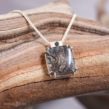 Load image into Gallery viewer, A glamorous Dendritic Quartz held by 8 tapered prongs is capped with a flush set Black Spinel and slides on a sleek silver wheat chain  Solid sterling silver, partially recycled  Dendritic Quartz, Black Spinel  Pendant: 17mm x 22mm  16&quot; Sterling chain, adjustable to 18&quot;  Lobster claw clasp
