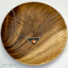Load image into Gallery viewer, A glowing Sunstone set in a striking patinated shadowbox with a geometric window. The crisp lines of this bold pendant are balanced with a heavy silver rolo chain. Details:  Solid sterling silver, partially recycled  Sunstone  Pendant: 35mm x 17mm  18&quot; sterling chain plus 2&quot; extender
