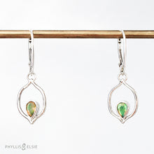 Load image into Gallery viewer, Dainty dangles with set with faceted Ethiopian opals suspended in a sterling frame. The faceted teardrop opals have stunning flashes of orange, yellow, and green depending on the light. Elegant lever-back ear hooks keep your new earrings secure with extra style.  Solid Sterling Silver, partially recycled  Natural Ethiopian Opals  Earring face - 12mm x 18mm  Sterling Lever-back ear hooks   
