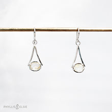 Load image into Gallery viewer, Light and airy Sterling Silver dangles set with Rutilated Quartz with golden inclusions for just a touch of sparkle.  Details:  Solid sterling silver, partially recycled  Rutilated Quartz  Earring faces: 12mm x 25mm  Sterling silver ear hooks
