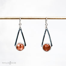 Load image into Gallery viewer, Shimmering Sunstones are suspended between polished silver strips that converge to a point. These bold dangles have all the impact of a big earring without too much weight.  Details  Solid sterling silver, partially recycled  Sunstone  Earring faces: 15mm x 39mm  Sterling ear wires
