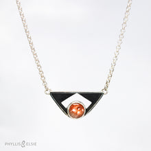 Load image into Gallery viewer, A glowing Sunstone set in a striking patinated shadowbox with a geometric window. The crisp lines of this bold pendant are balanced with a heavy silver rolo chain.  Details:  Solid sterling silver, partially recycled  Sunstone  Pendant: 35mm x 17mm  18&quot; sterling chain plus 2&quot; extender
