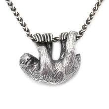 Load image into Gallery viewer, Our charming Three-Toed Sloth hangs happily from a lovely wheat chain, happy to watch the world from a safe perch around your neck! With life-like detail and cuteness to spare, your new silver pal is sure to draw lots of compliments!  We donate a portion of all WildWhere sales to support continuing wildlife conservation efforts!
