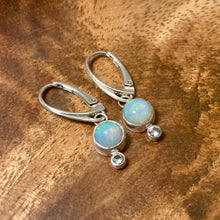 Load image into Gallery viewer, Sweet dewdrops of Ethiopian Opals glow with shades of blue, green, and peach. White Sapphires at an extra touch of sparkle and elegant lever-back ear hooks keep your earrings secure with extra style.  Solid sterling silver, partially recycled  Ethiopian Opal, White Sapphire  Earring face: 8mm x 15mm  Sterling lever-back ear hooks
